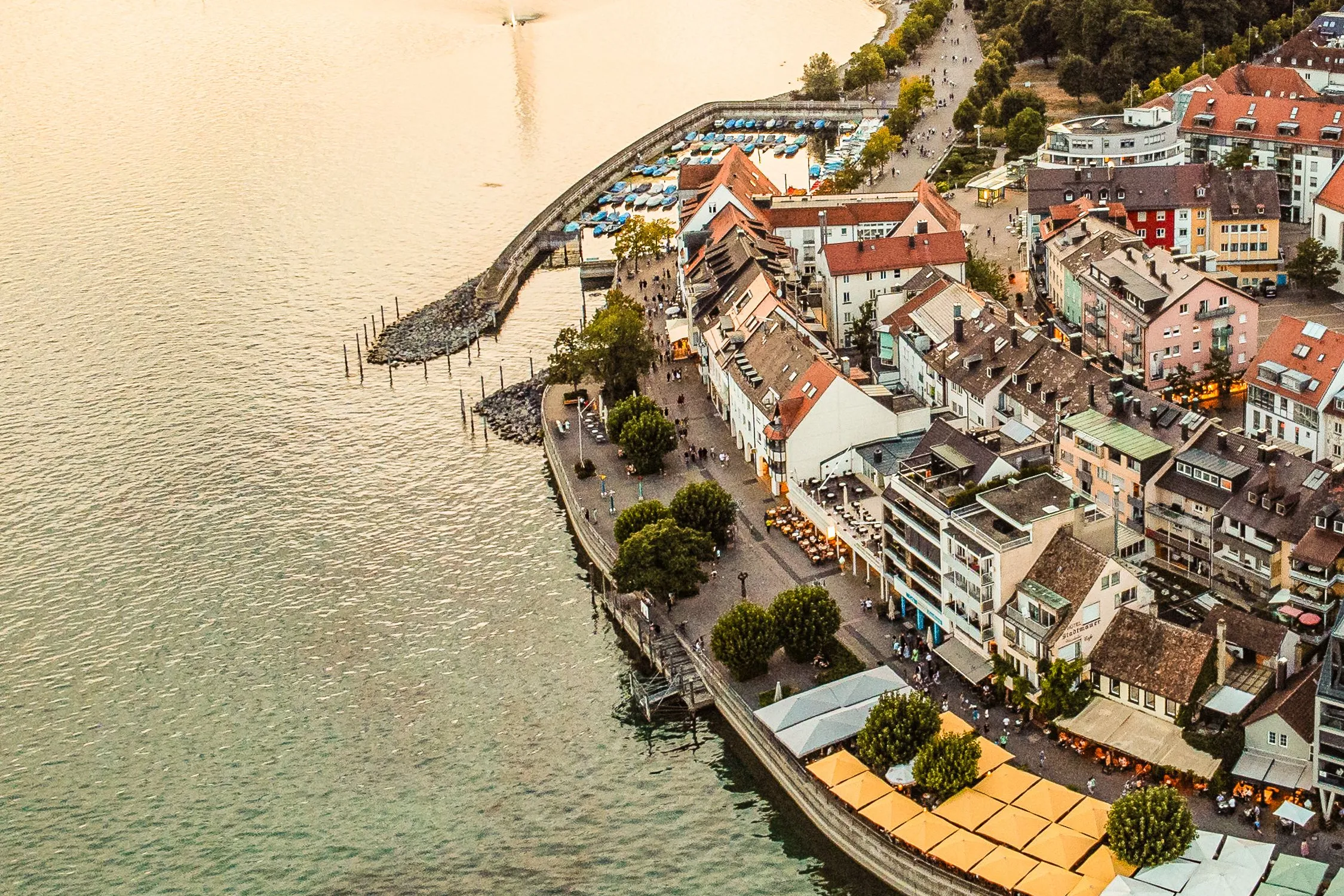 Aerial view of the lakeside promenade and old town of Friedrichshafen in the evening sun