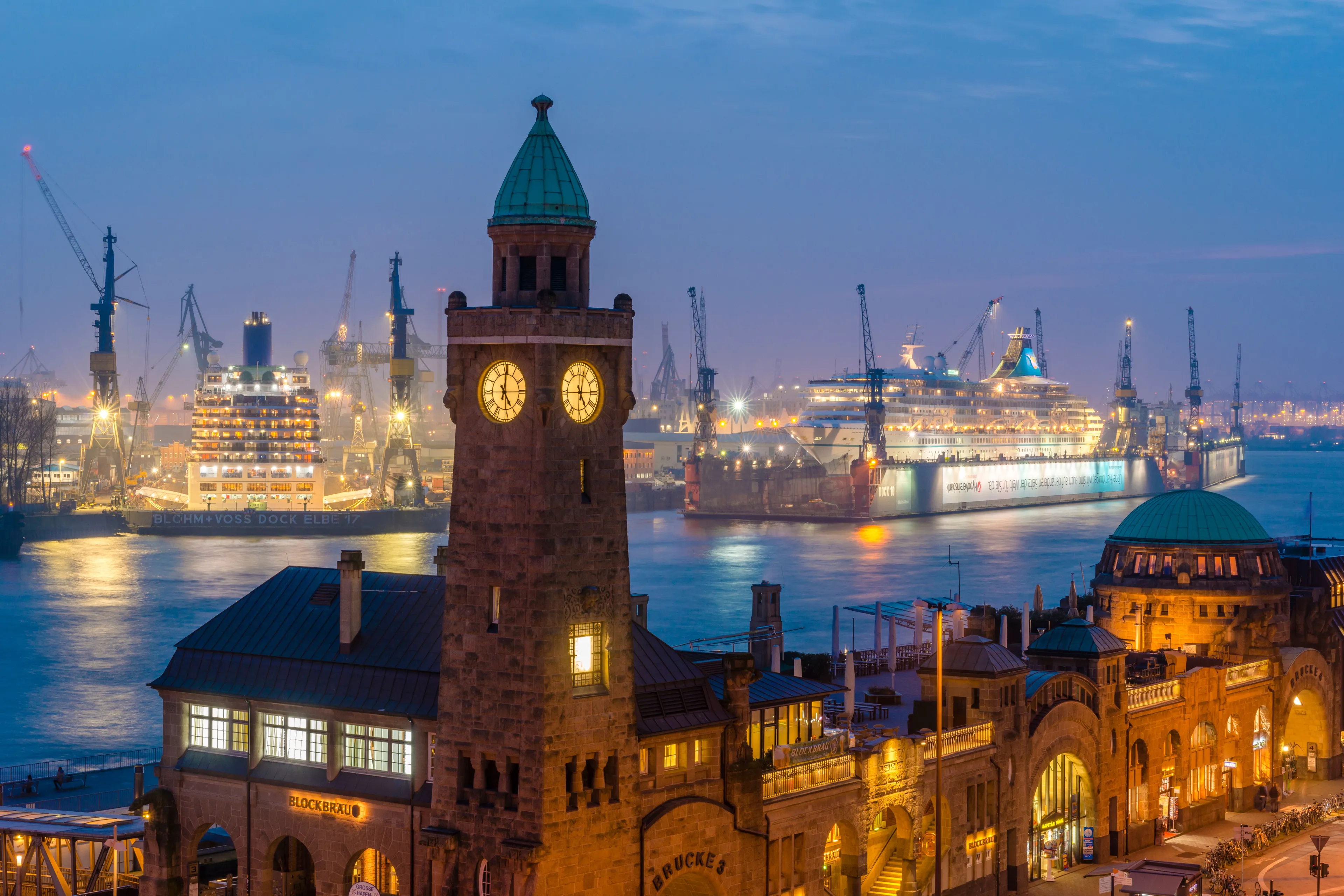 St. Pauli Landungsbrücken with the clock tower at dusk