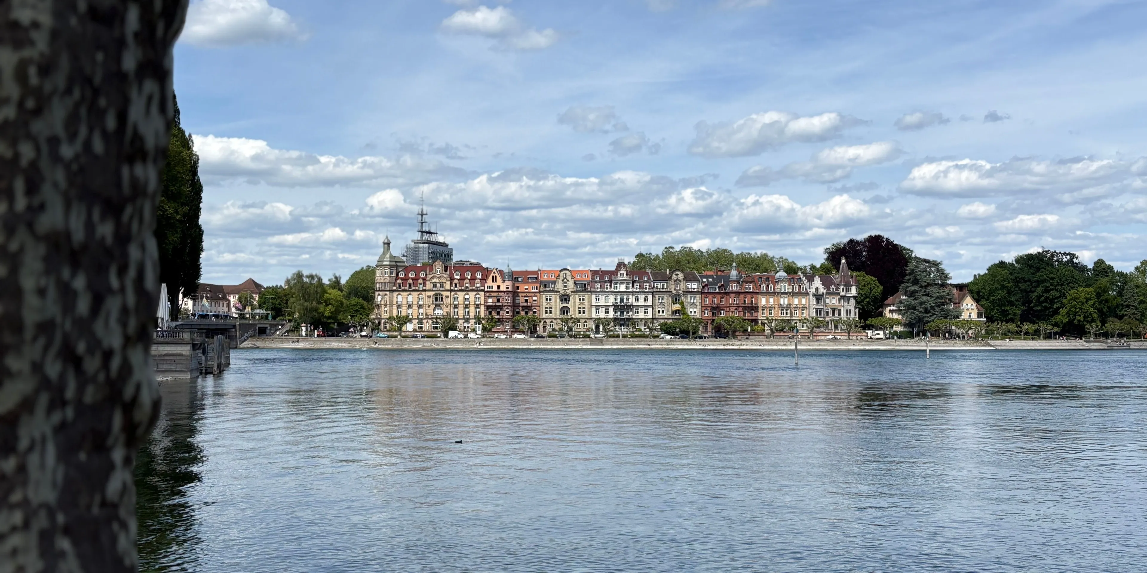 Row of grand late 19th-century villas on the Konstanz lakefront, seen across calm water